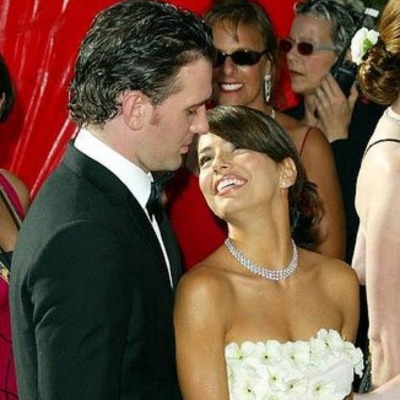 JC Chasez and his former girlfriend, Eva Longoria, looking at each other.